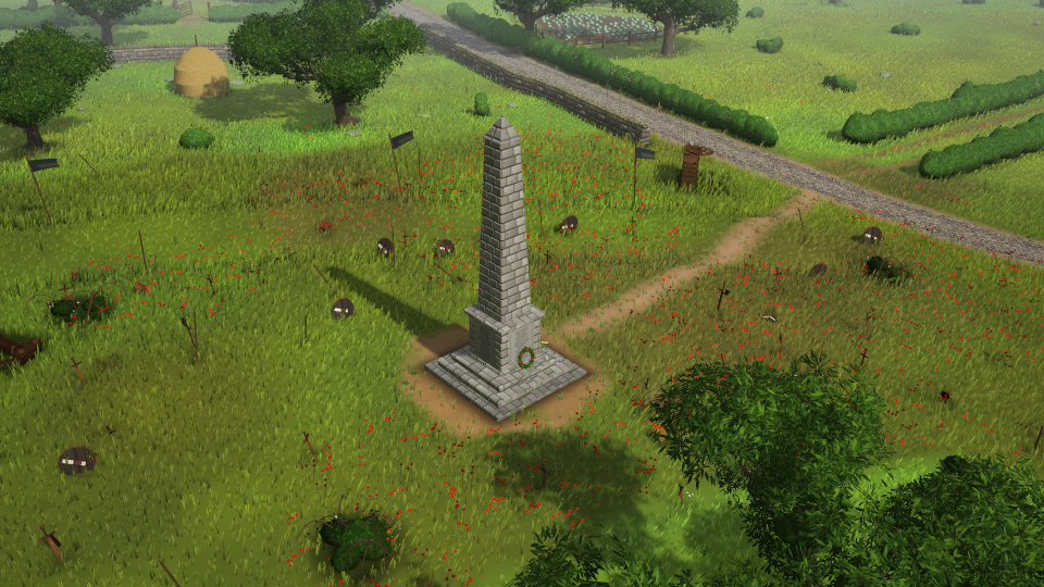 A tall stone memorial standing alone in a field.