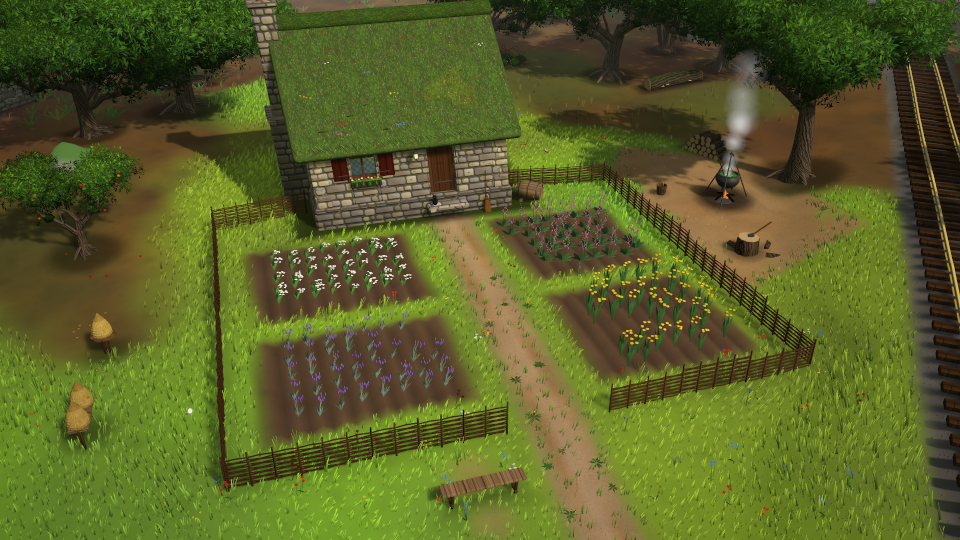 A cottage with a vegetable garden laid out in neat beds.